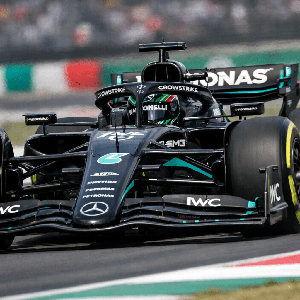Front view of a black Mercedes AMG Formula 1 car on a race track
